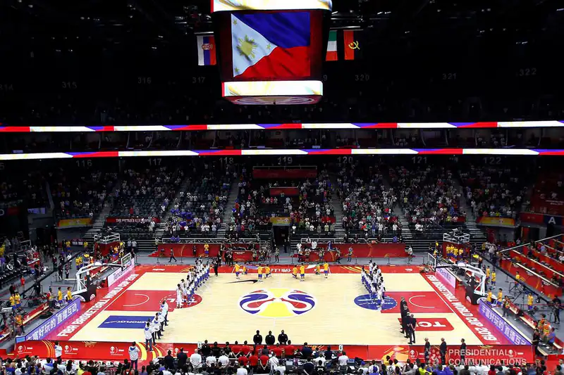 Gilas Pilipinas playing at the 2019 FIBA World Cup with the Philippine flag above the court